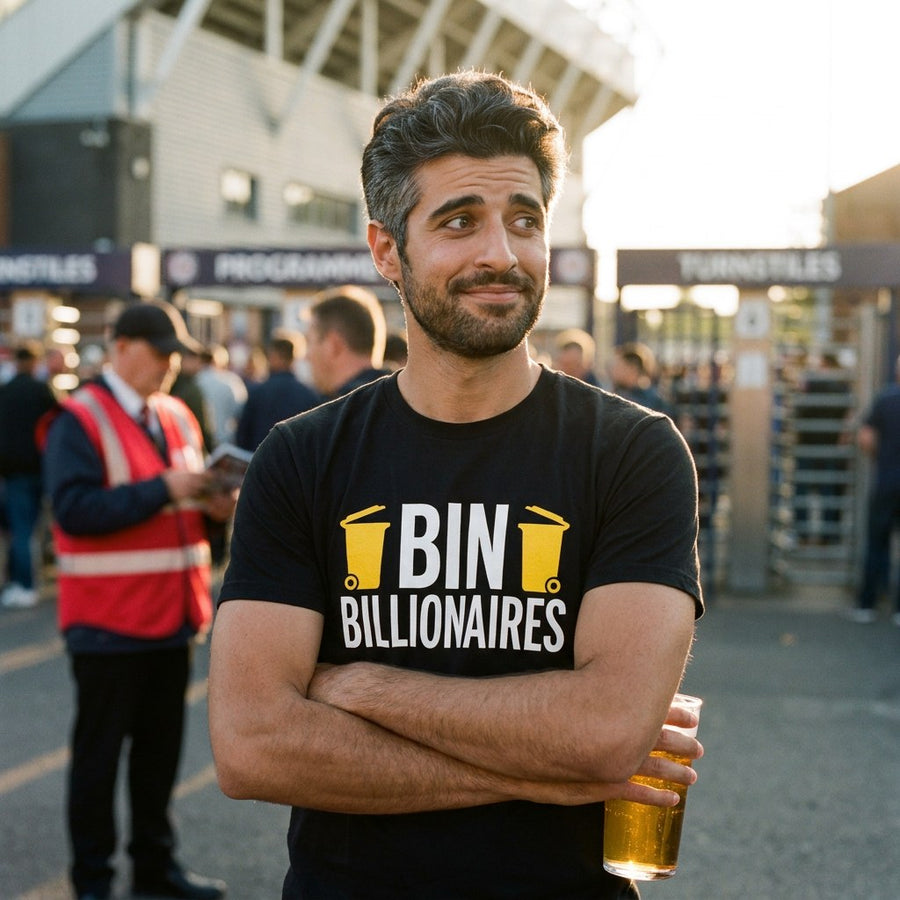 Man in a black Bin Billionaires t-shirt outside a football ground