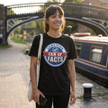 Woman in a black Certified Fan of Facts t-shirt on a canal towpath