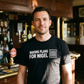 Man in a black Making Plans for Nigel t-shirt in a British pub