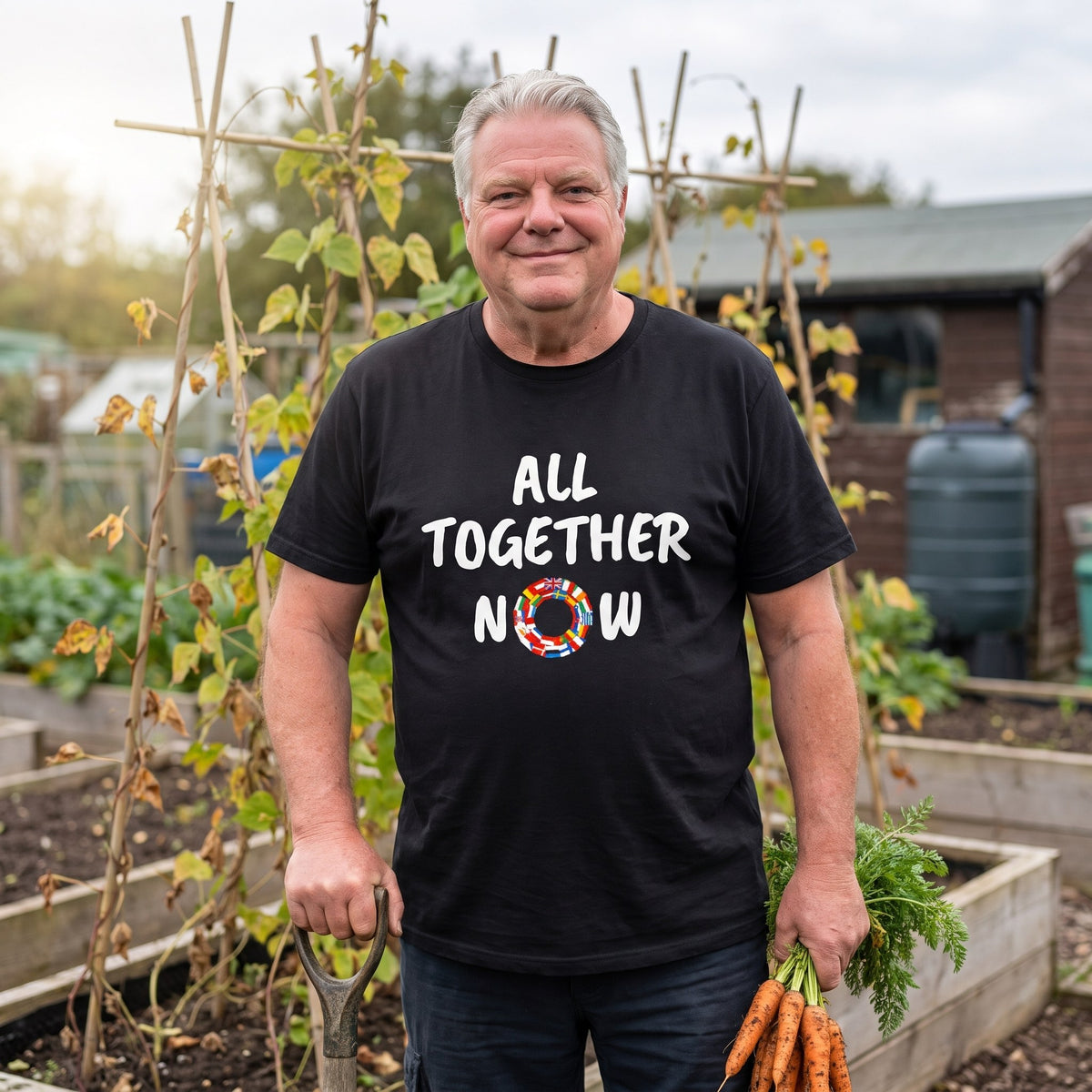 Older man on an allotment wearing the black All Together Now t-shirt with a ring of European flags