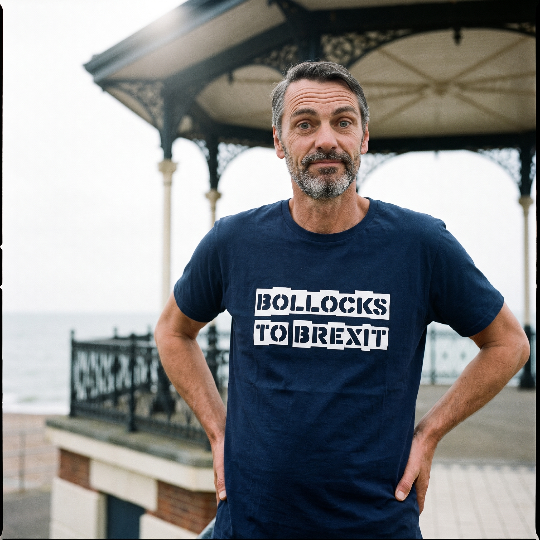 Man in a navy Bollocks to Brexit t-shirt beside a seafront bandstand, Very Brexit Problems