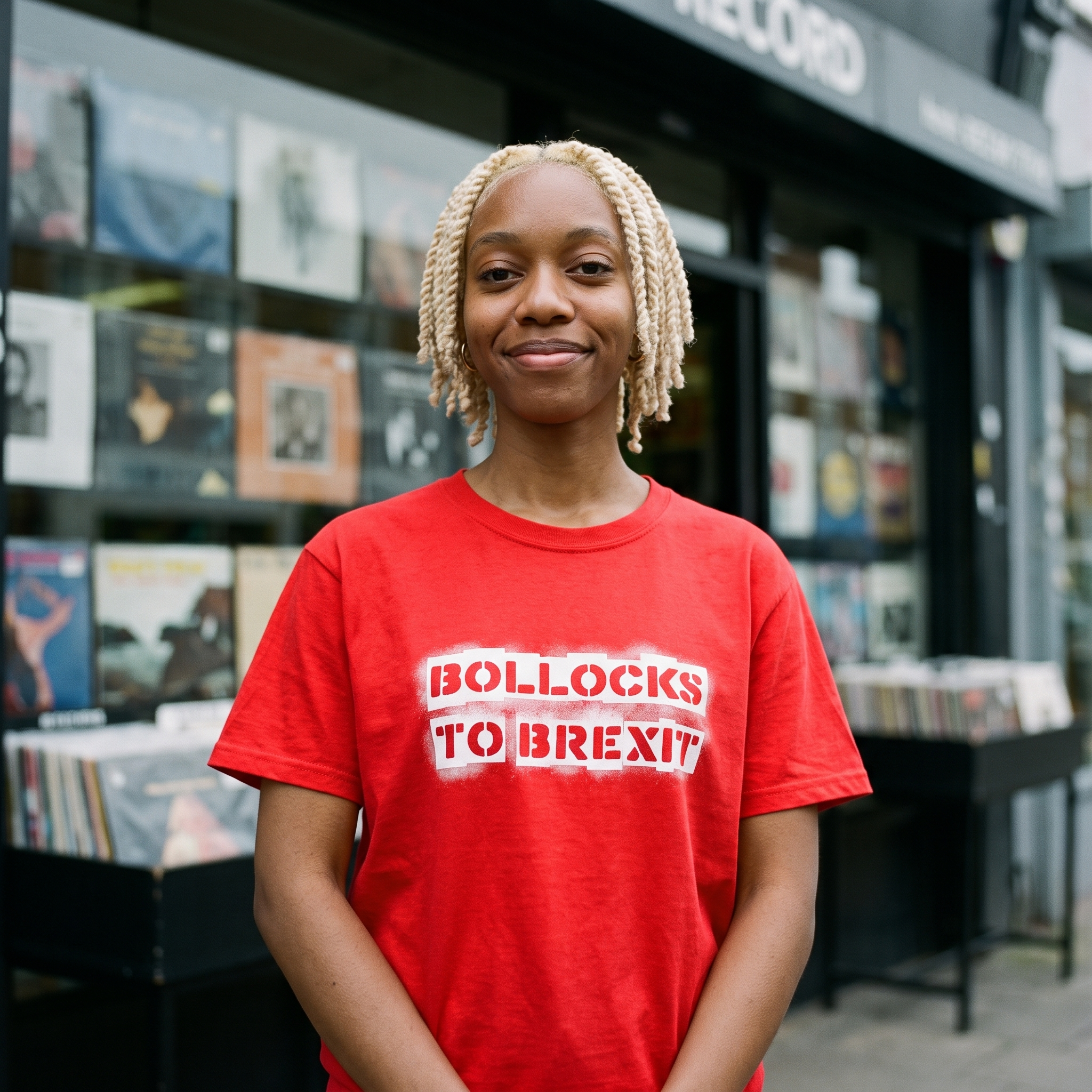 Woman in a red Bollocks to Brexit t-shirt outside a record shop, Very Brexit Problems