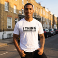 Man in a white I Think Therefore I Am Not a Daily Mail Reader t-shirt on a sunlit brick street, Very Brexit Problems