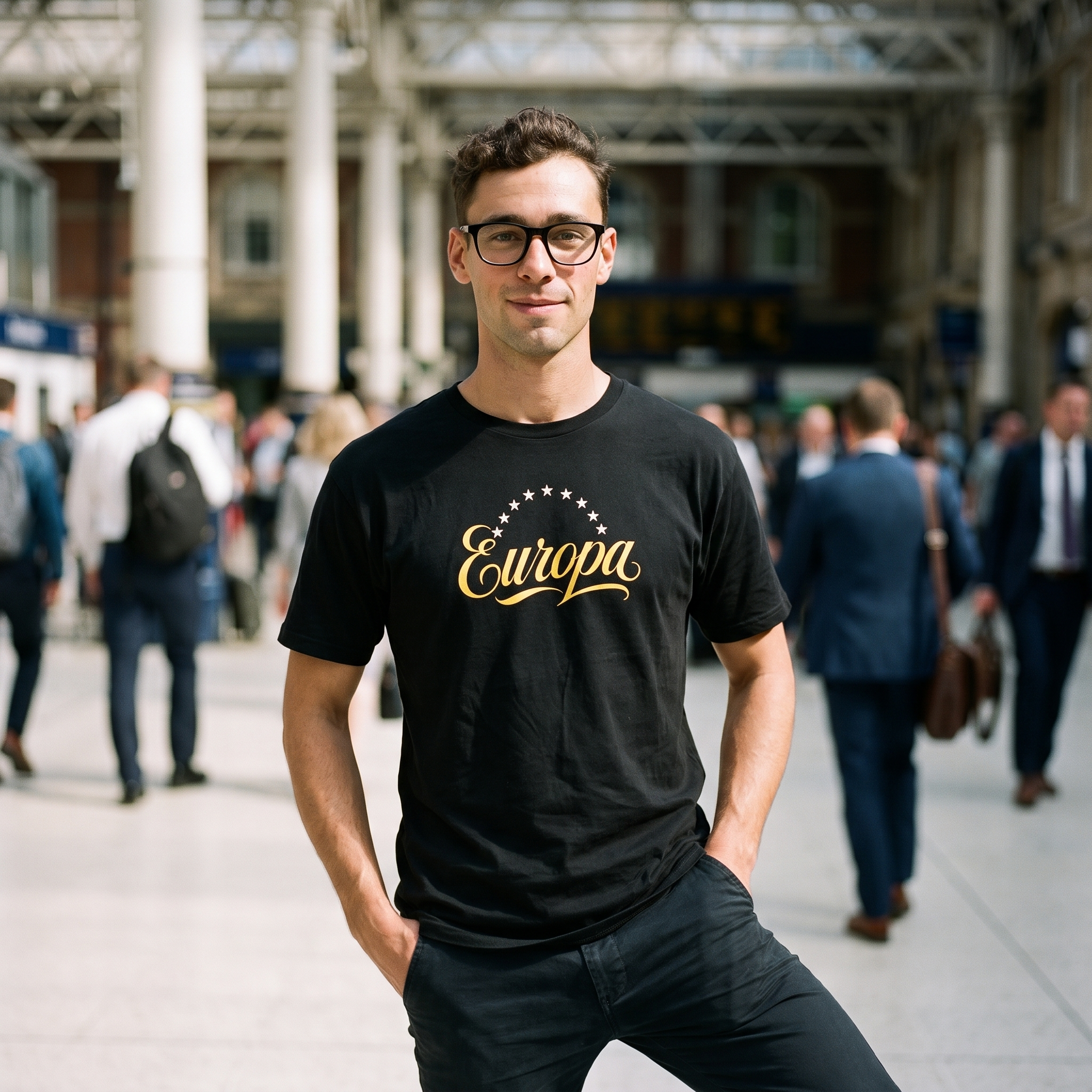 Man in a black Europa t-shirt on a railway station concourse, Very Brexit Problems