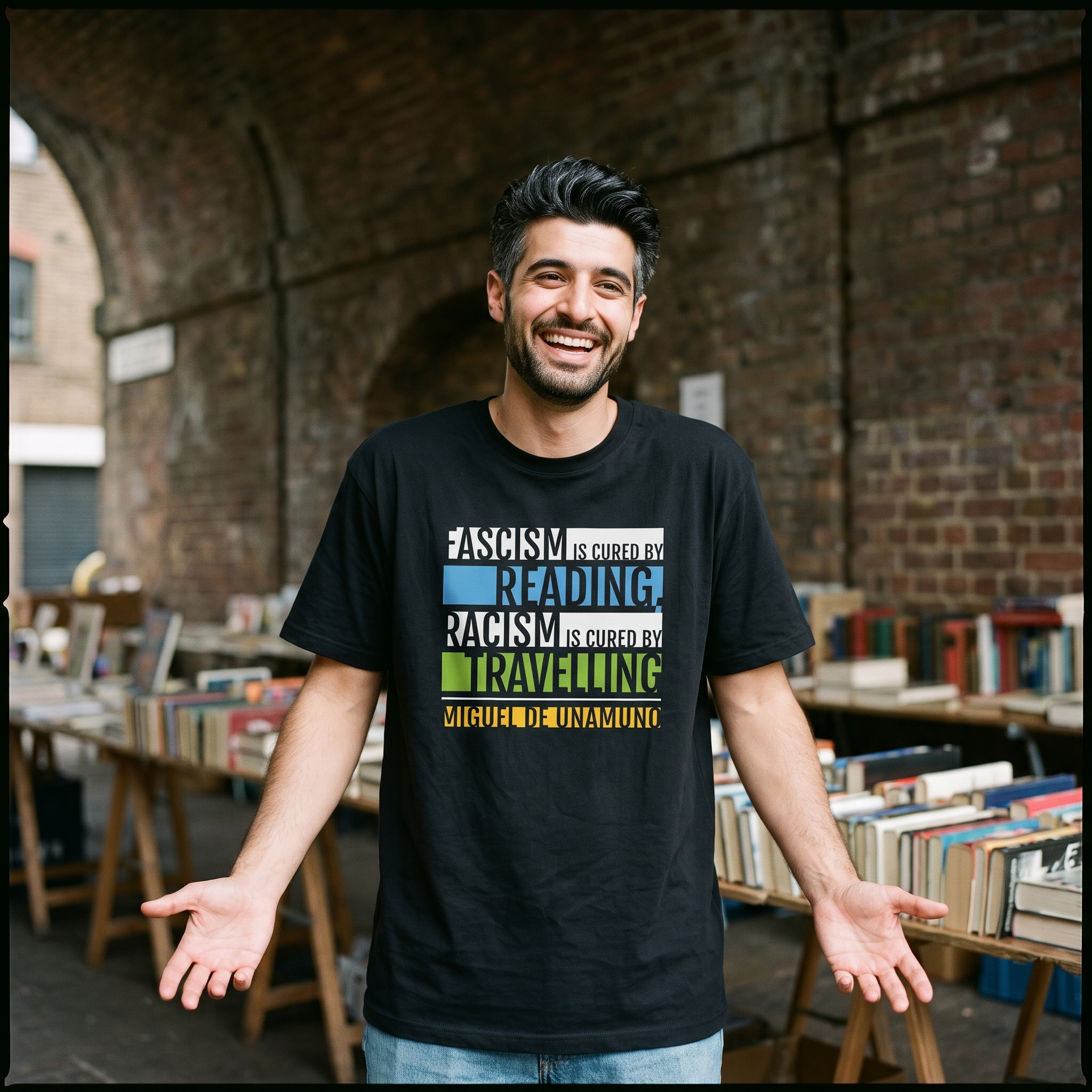Man in a black Fascism is Cured by Reading t-shirt at a bookstall under a railway arch, Very Brexit Problems