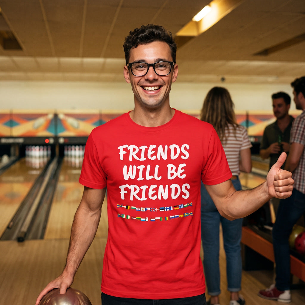 Man at a bowling alley in a red Friends Will Be Friends t-shirt