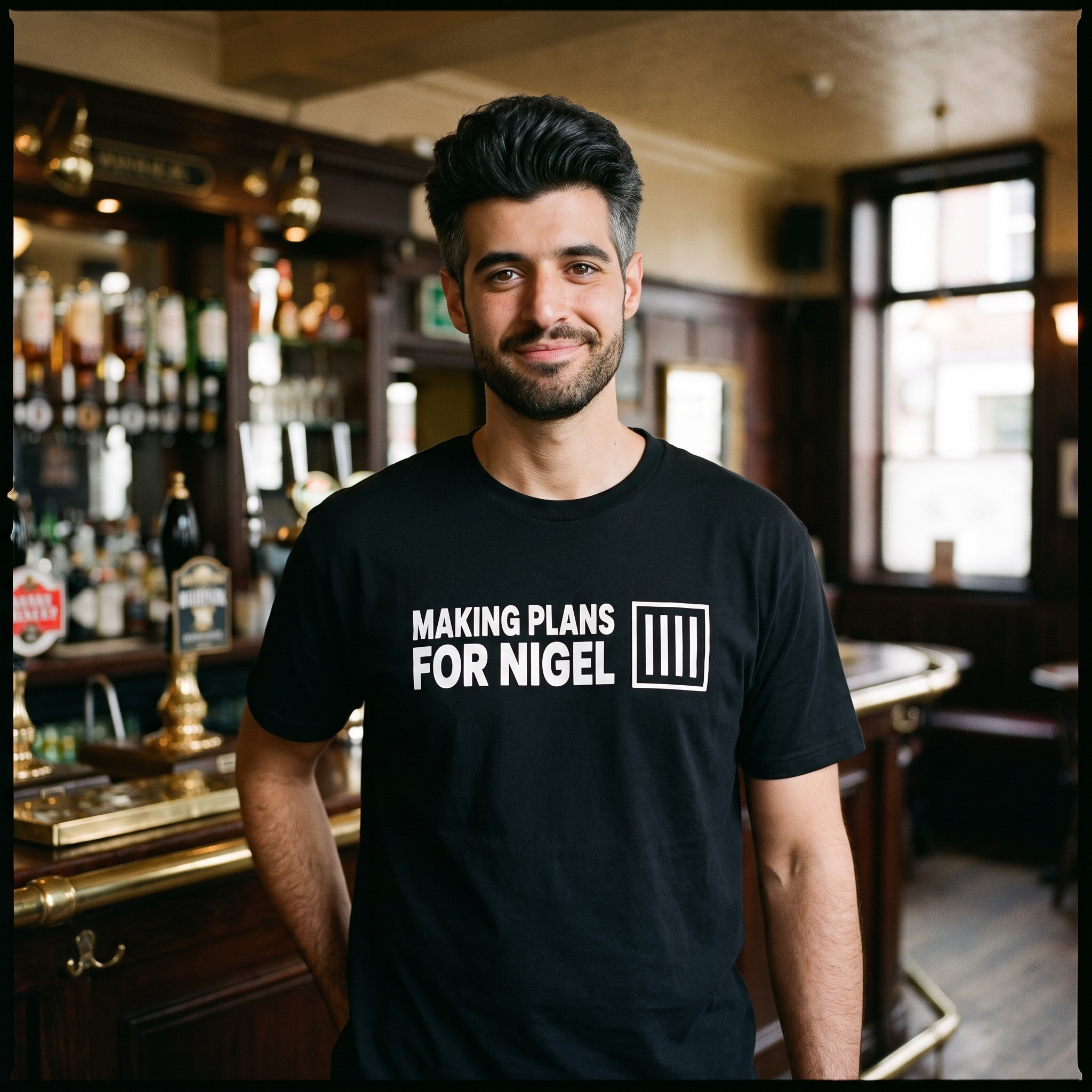 Man in a black Making Plans for Nigel t-shirt inside a traditional pub, Very Brexit Problems