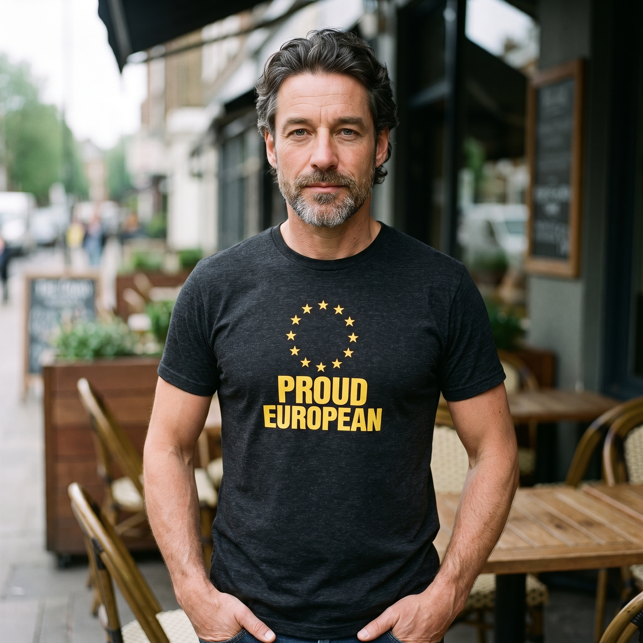 Man in a black heather Proud European t-shirt on a cafe terrace, Very Brexit Problems