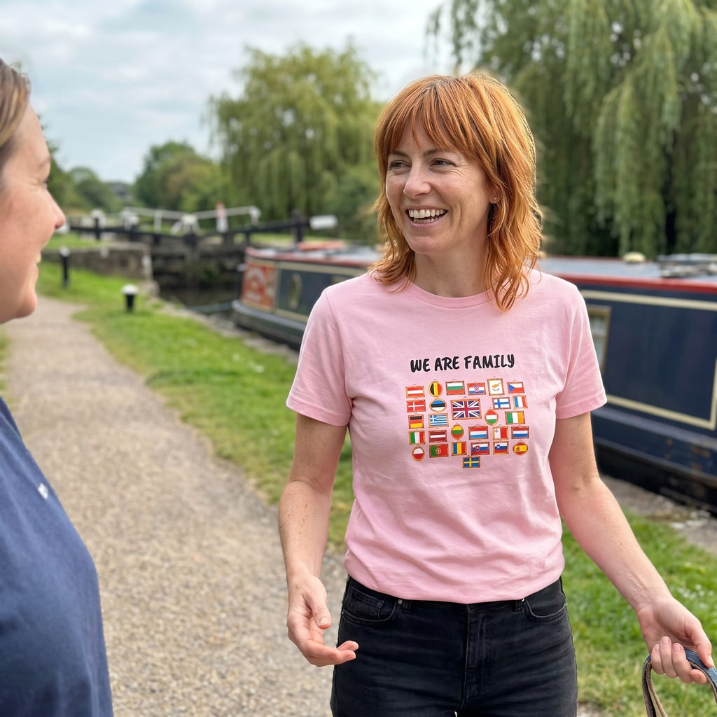 Woman chatting on a canal towpath wearing the pink We Are Family European flags t-shirt, Very Brexit Problems