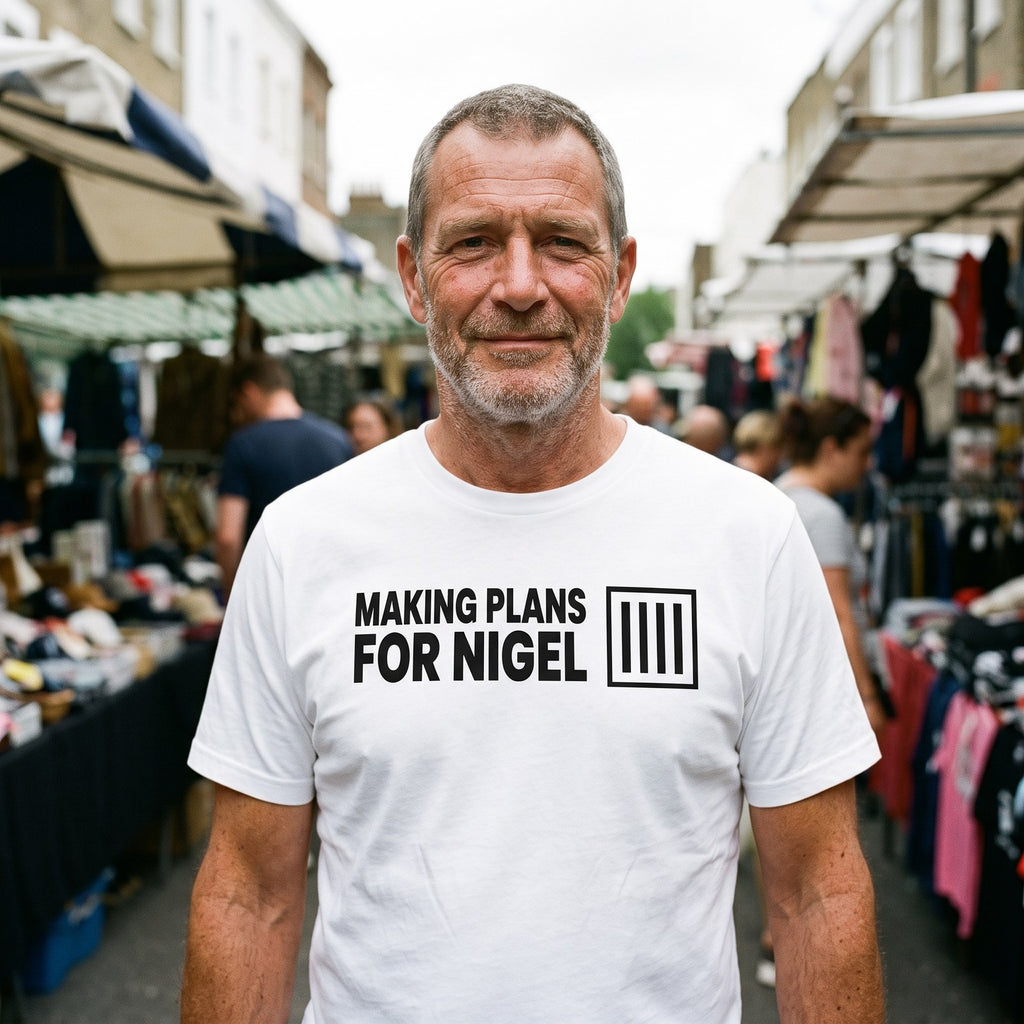 Man in a white Making Plans for Nigel t-shirt at a British street market