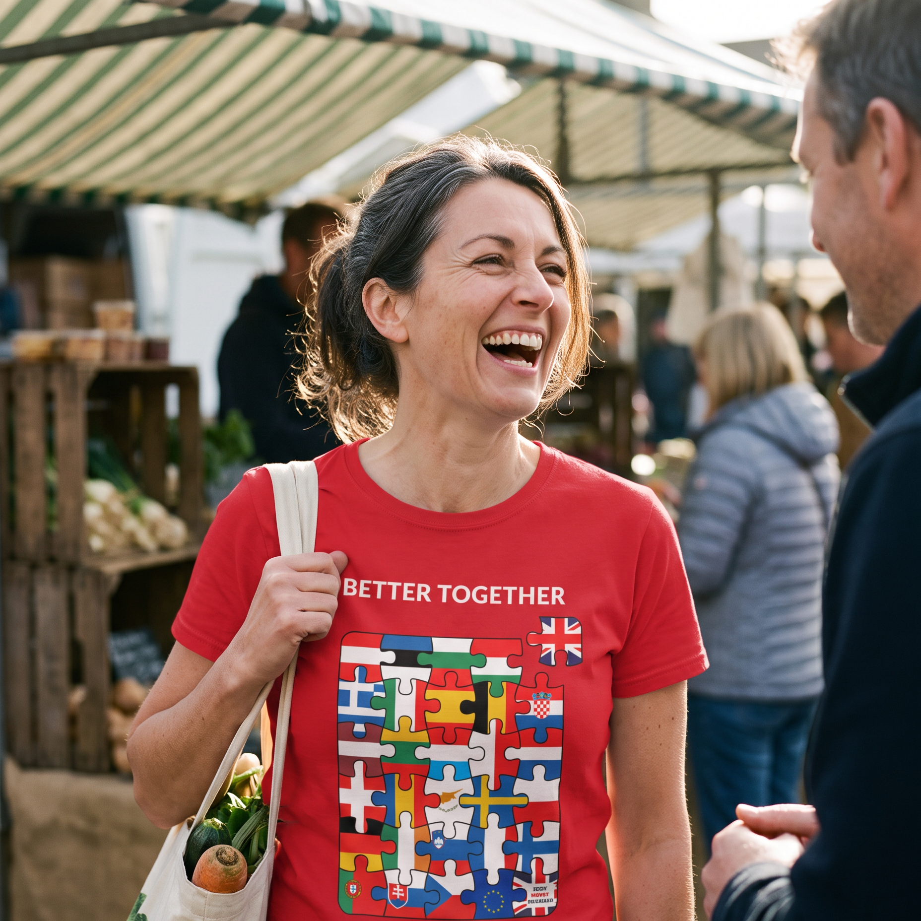 Woman laughing at a farmers market with a tote bag, wearing the red Better Together t-shirt, print close and legible, Very Brexit Problems