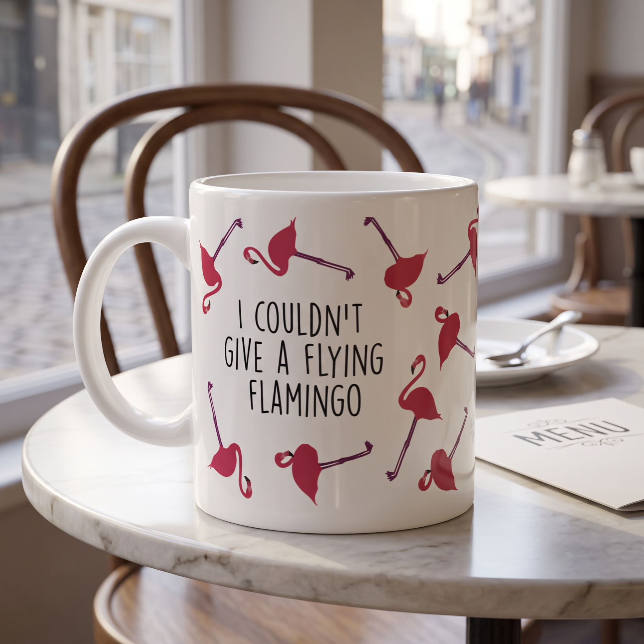 Couldn't Give a Flying Flamingo mug on a cafe table, print close and legible, Very Brexit Problems