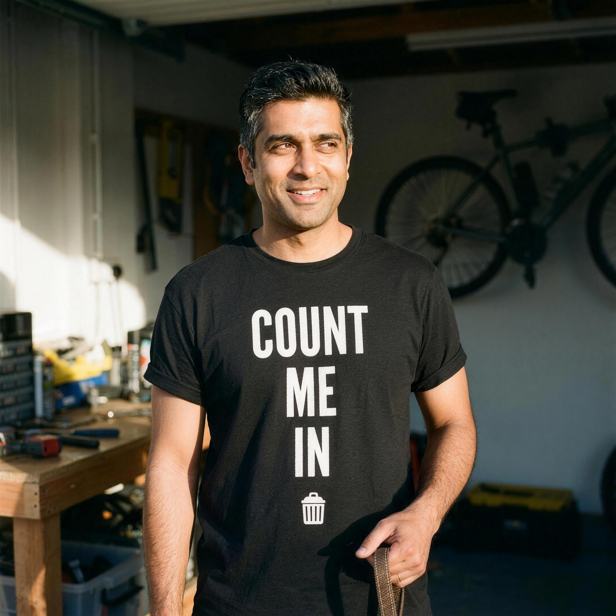A man wearing the black Count Me In t-shirt, print close and legible, Very Brexit Problems