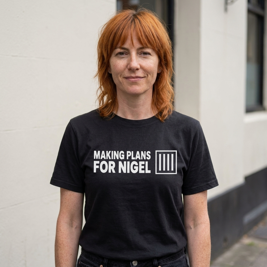 Woman in a black Making Plans for Nigel t-shirt outside a British pub