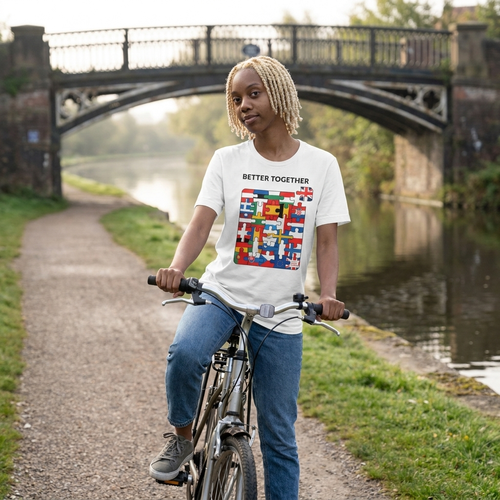Woman on a bicycle in a white Better Together t-shirt on a canal towpath