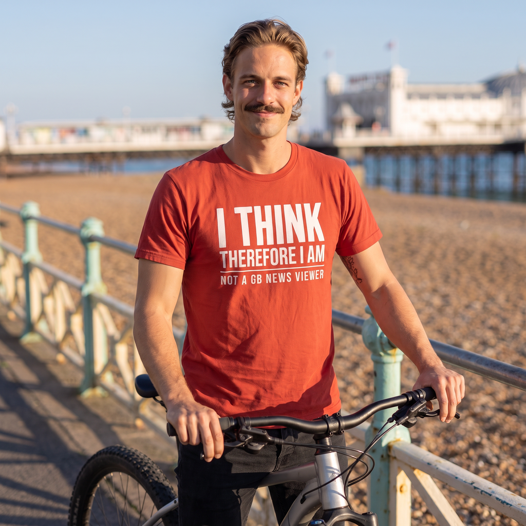 Man with a mountain bike on Brighton seafront wearing the red I Think Therefore I Am Not a GB News Viewer t-shirt, Very Brexit Problems
