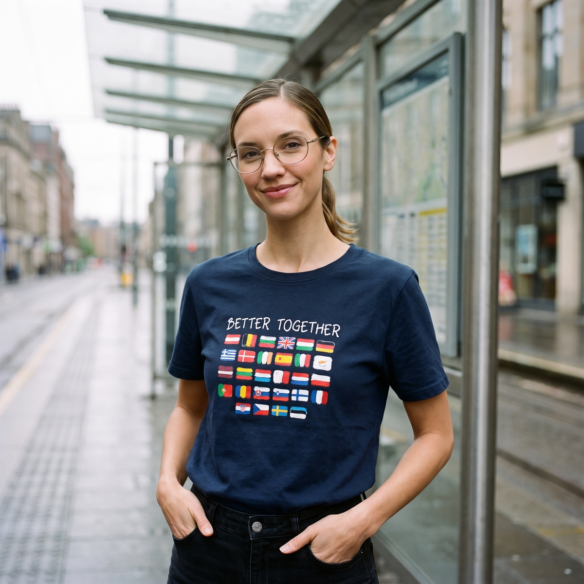 Woman in a navy Better Together t-shirt at a tram stop, Very Brexit Problems