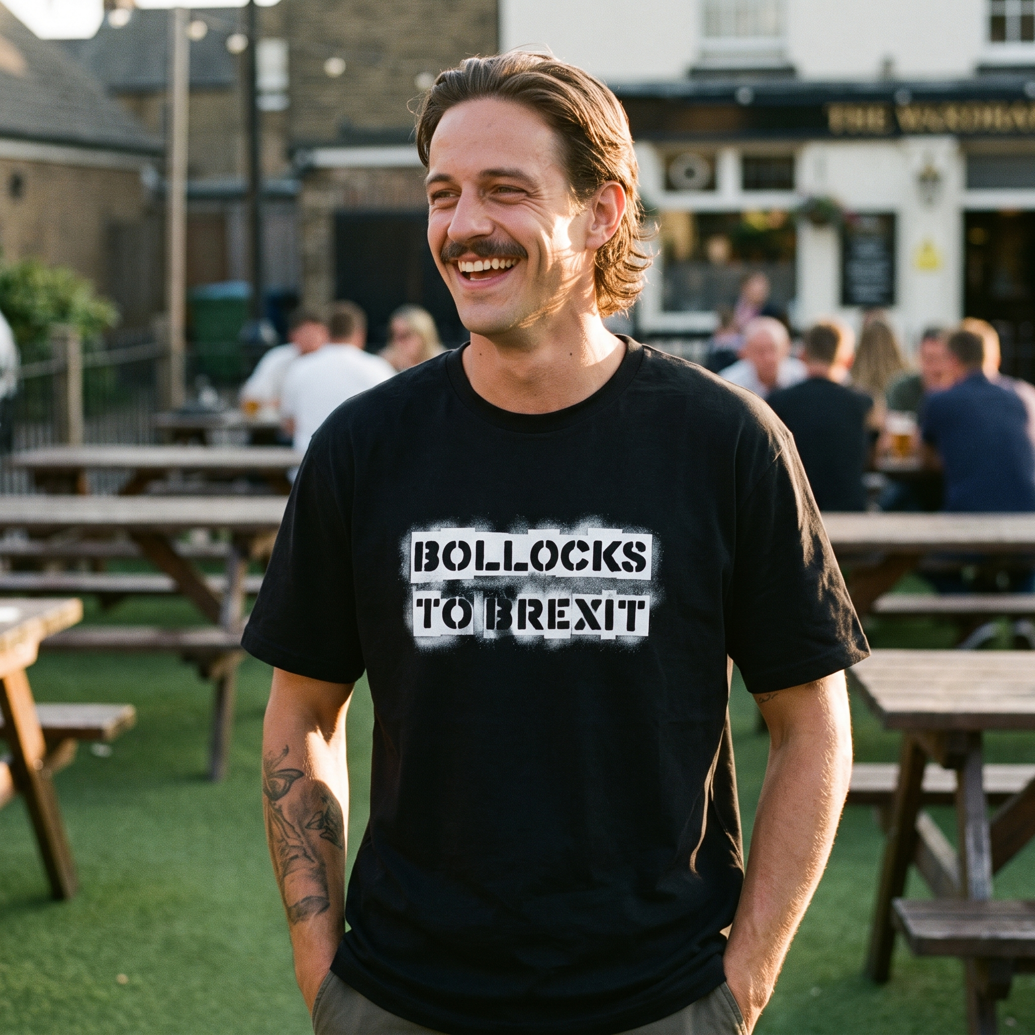 Man in a black Bollocks to Brexit t-shirt in a pub beer garden, Very Brexit Problems