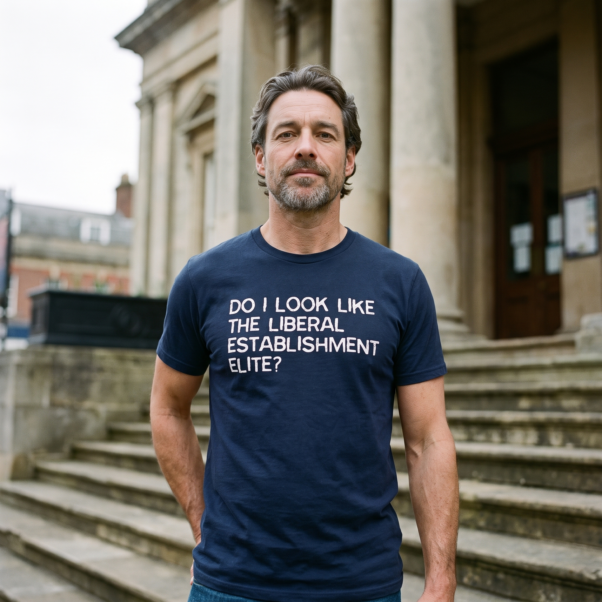 Man in a navy Do I Look Like the Liberal Establishment Elite t-shirt on the steps of a town library, Very Brexit Problems