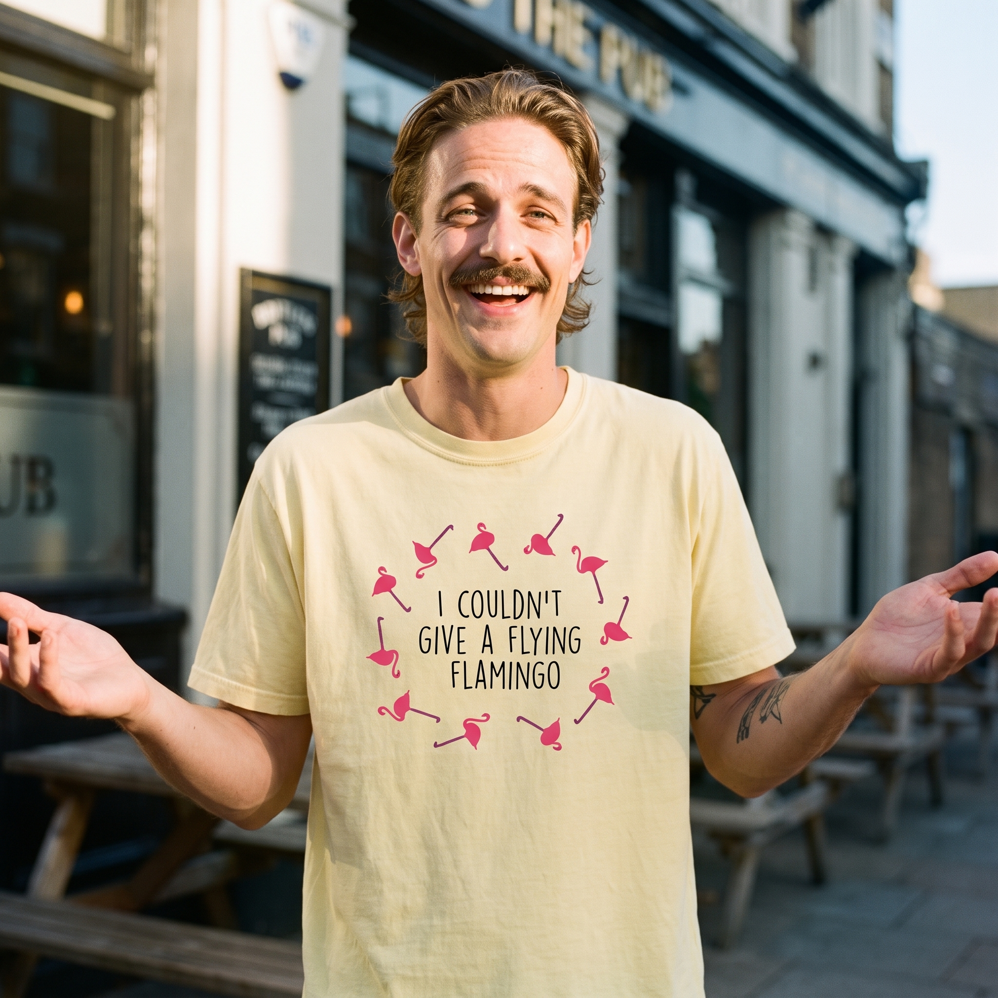 Man in a yellow I Couldn't Give a Flying Flamingo t-shirt outside a pub, Very Brexit Problems