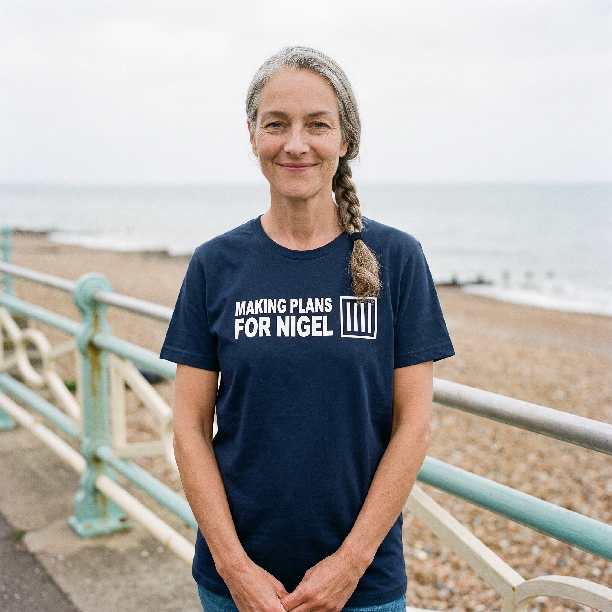 Woman in a navy Making Plans for Nigel t-shirt on an English seaside promenade, Very Brexit Problems