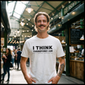 Man in a white I Think Therefore I Am Not a Brexit Supporter t-shirt at a covered food market, Very Brexit Problems